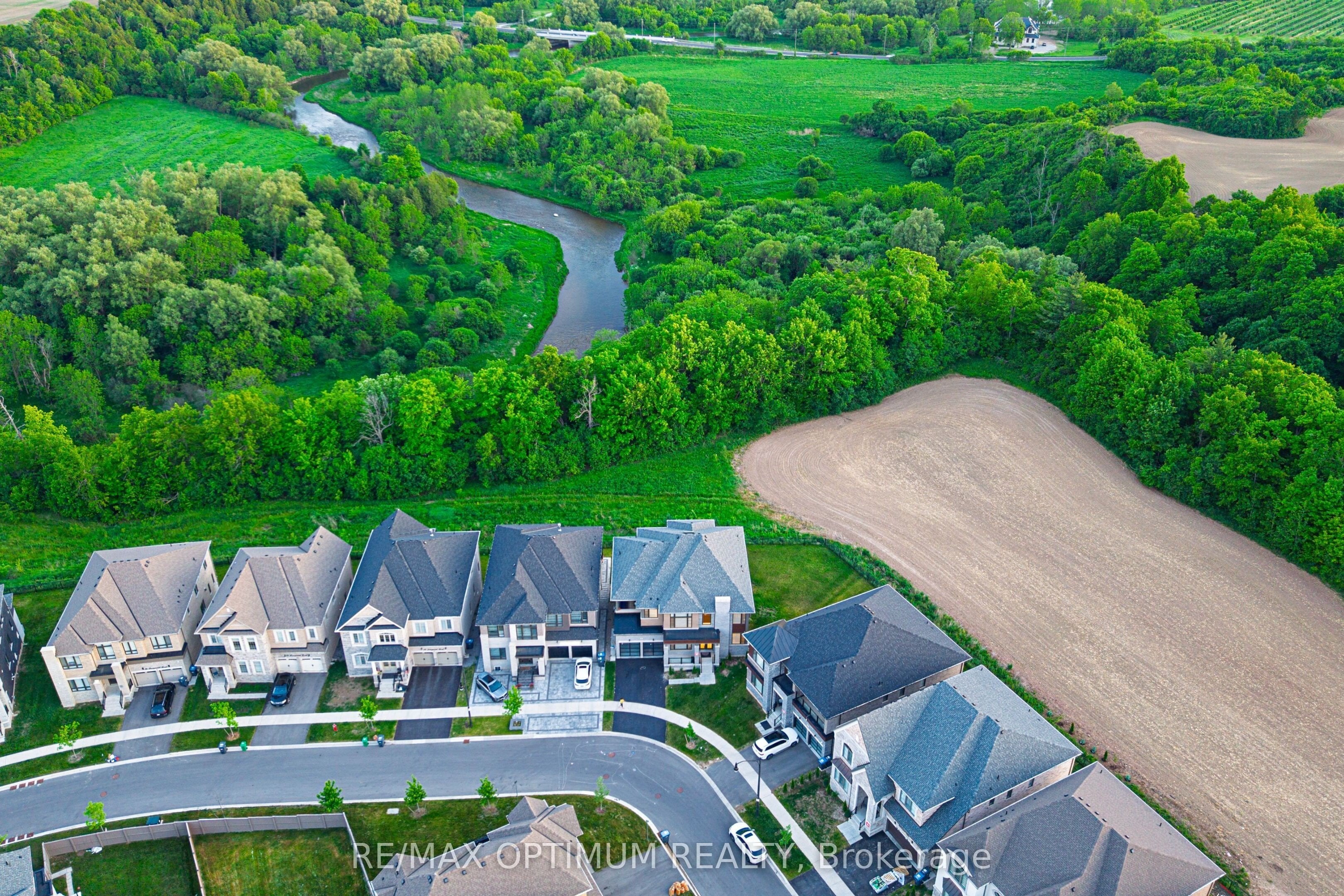 Aerial view of a GTA neighbourhood backing onto a ravine and open fields